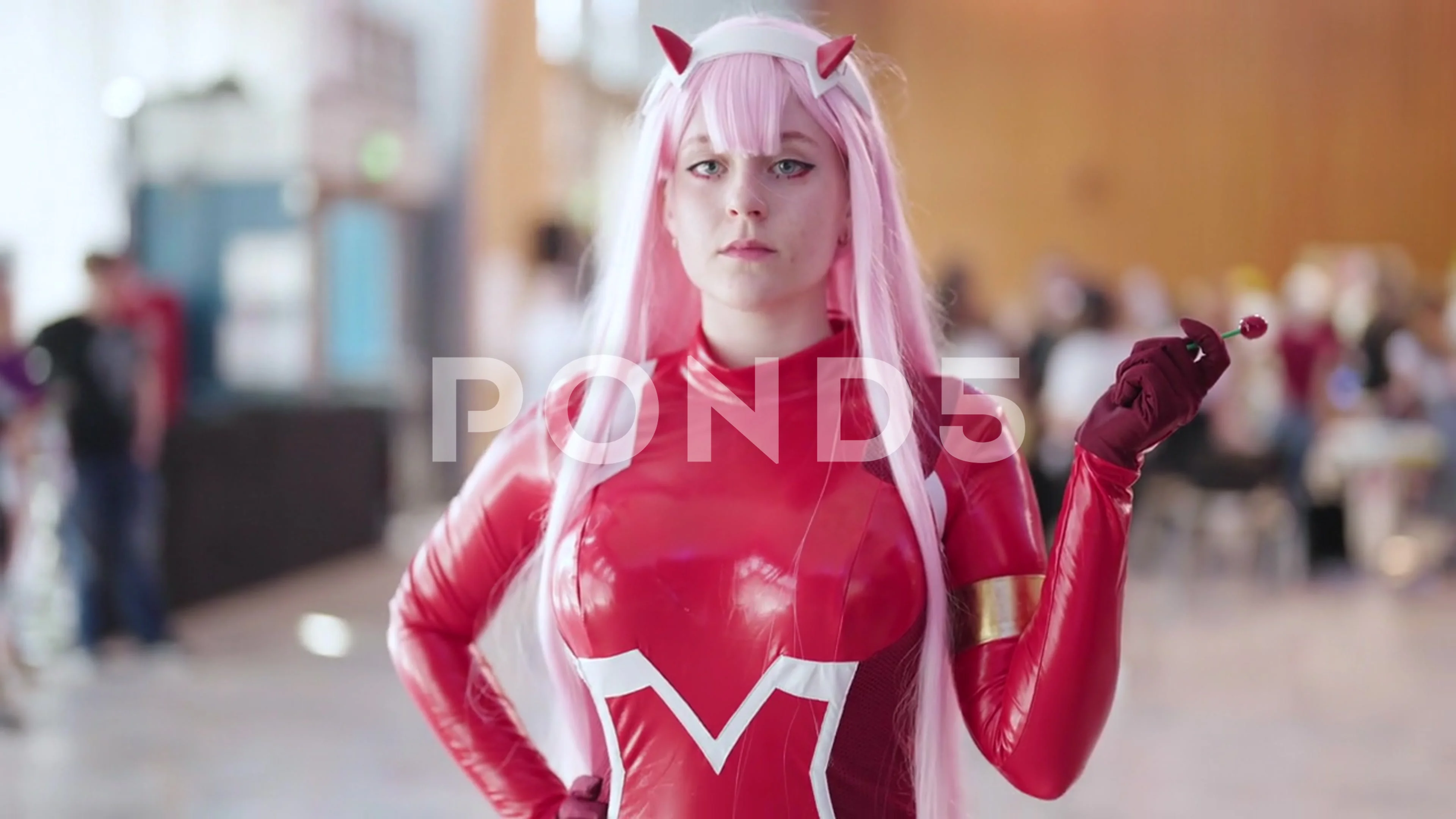 Zero Two anime cosplay girl in suit hold, Stock Video