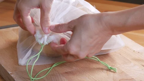 Zero vaste lifestyle concept Pull off potatoes of the reusable bag 2 Stock Footage 107216573