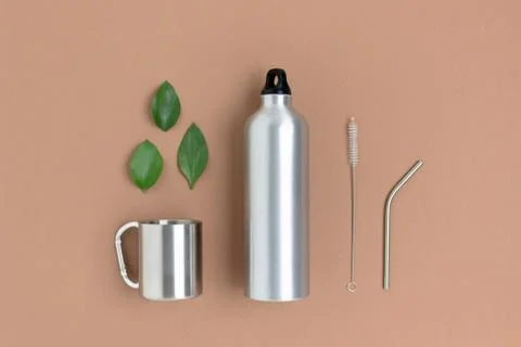 Zero waste accessories for drinking on a brown background. Stock Photos