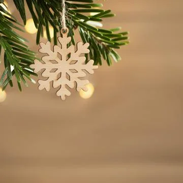Zero waste and eco friendly christmas concept. Wooden snowflake on a Christma Stock Photos