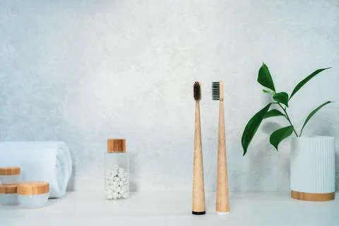 Zero waste bathroom items. Bamboo toothbrushes, natural mouth washing tabs Stock Photos