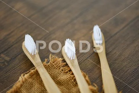 Zero waste Bathroom use less plastic concept / bamboo toothbrush on the sack Stock Photos
