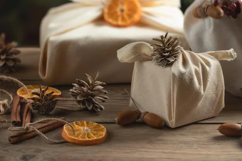 Zero waste christmas concept. Packed in natural fabric gifts and decorations  Stock Photos
