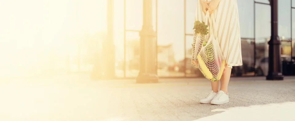 Zero waste concept with copy space. Woman holding cotton shopper and reusable Stock Photos