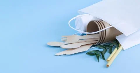 Zero waste concept, eco biodegradable tableware in paper bag Stock Photos