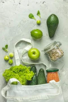 Zero waste concept. Eco-friendly shopping, flat lay. Fresh organic green vege Stock Photos