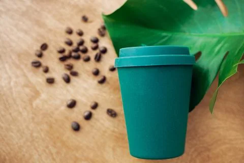 Zero waste concept, flat lay. Stylish reusable eco coffee cup  on wooden back Stock Photos