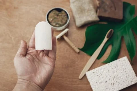 Zero waste concept. Hand holding natural eco crystal deodorant on background  스톡 사진
