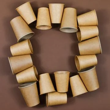 Zero waste concept. Paper glasses on a brown background. Place for an Stock Photos