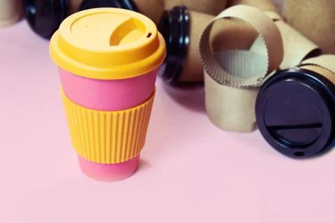 Zero waste concept reusable eco coffee cup vs multiple single use cardboard cups Stock Photos
