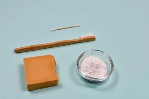 Zero waste concept. Toothbrush, tooth powder and soap on a blue background. Eco Stock Photos