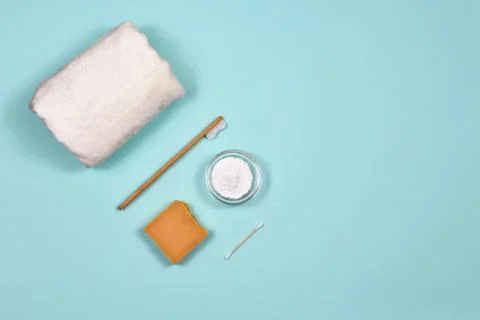 Zero waste concept. Toothbrush, tooth powder, towel and soap on a blue Stock Photos