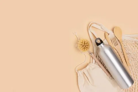 Zero waste cutlery items on a beige background. Stock Photos