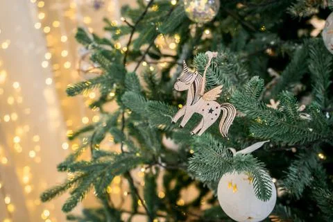 Zero waste decoration of christmas tree with woden unicorn, boke Stock Photos