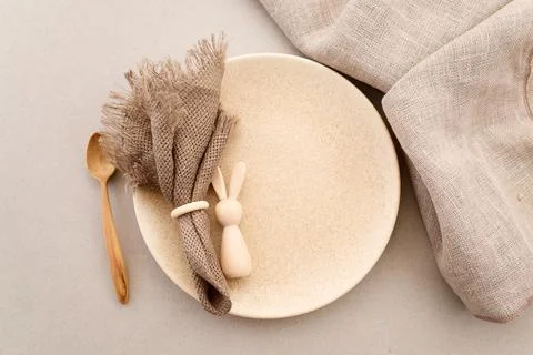 Zero waste Easter. Easter table setting with wooden bunny and linen napkin 스톡 사진
