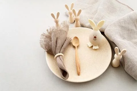 Zero waste Easter. Easter table setting with rustic bunny decorations Stock Photos