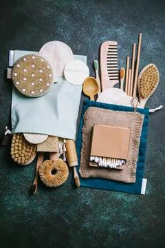 Zero waste. Eco friendly bathroom and kitchen accessories on a green backgrou Stock Photos