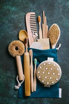 Zero waste. Eco friendly bathroom and kitchen accessories on a green backgrou Stock Photos