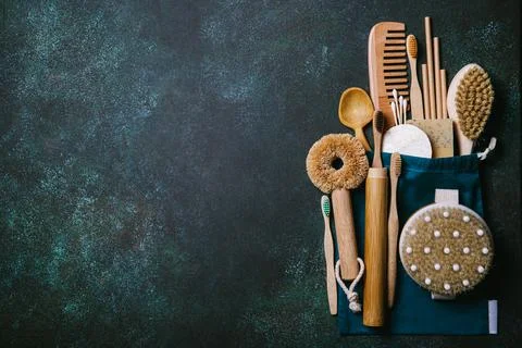 Zero waste. Eco friendly bathroom and kitchen accessories on a green backgrou Stock Photos