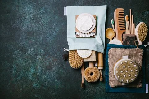 Zero waste. Eco friendly bathroom and kitchen accessories on a green backgrou Stock Photos