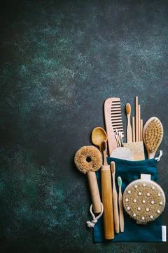 Zero waste. Eco friendly bathroom and kitchen accessories on a green backgrou Stock Photos