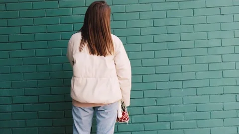 Zero waste eco living concept. Young caucasian woman puts groceries in a Stock Footage 160053670