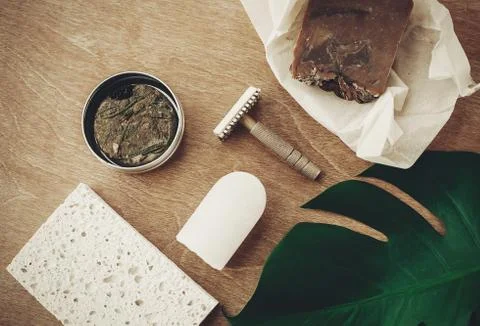 Zero waste flat lay. Natural soap, solid shampoo in metal tin, reusable razor Stock Photos