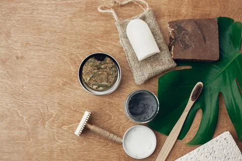 Zero waste flat lay. Natural soap, solid shampoo, metal razor, crystal deodor Stock Photos