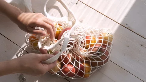 Zero waste home and eco bag. Eco Shopping. Reusable grocery bags with fruits and Stock Footage 124794553