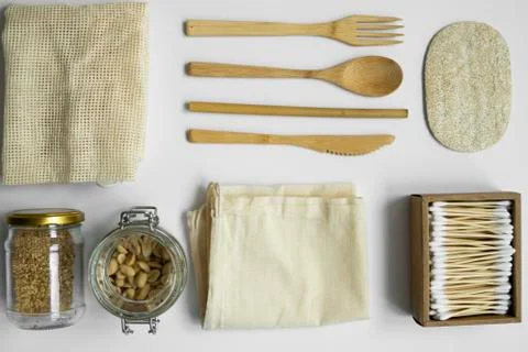 Zero waste kit. Set of eco friendly bamboo cutlery, mesh cotton bags, glass jars Stock Photos