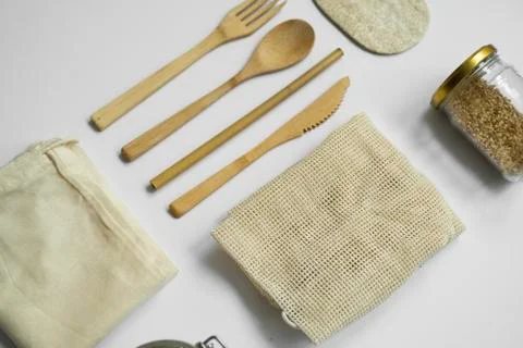 Zero waste kit. Set of eco friendly bamboo cutlery, mesh cotton bags, glass jars Stock Photos