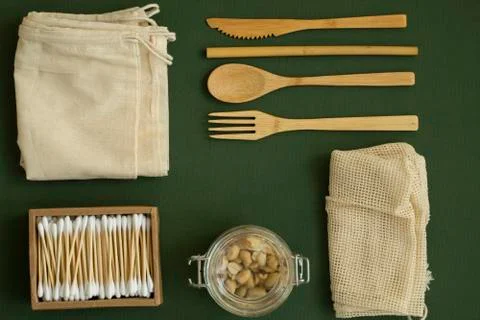 Zero waste kit. Set of eco friendly bamboo cutlery, mesh cotton bags, glass jars Stock Photos
