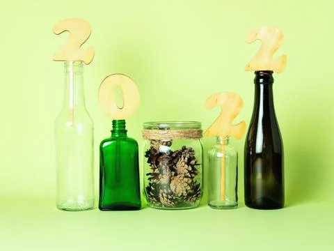 Zero waste New Year composition of glass and wooden objects with pinecones. Stock Photos