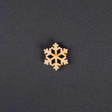The zero waste new year concept as the wooden snowflake on the grey background. Stock Photos