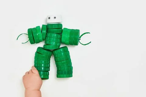 Zero waste, the second life of things. Toy robot made of plastic caps Stock Photos