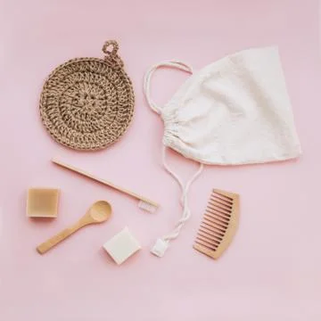 Zero waste set for bathing on light pink background. Stock Photos