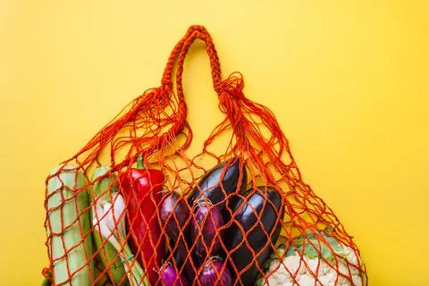 Zero waste shopping concept. vegetables in mesh bag without plastic Stock Photos