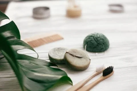 Zero waste solid shampoo bar, bamboo toothbrushes, wooden brush and konjaku s Stock Photos