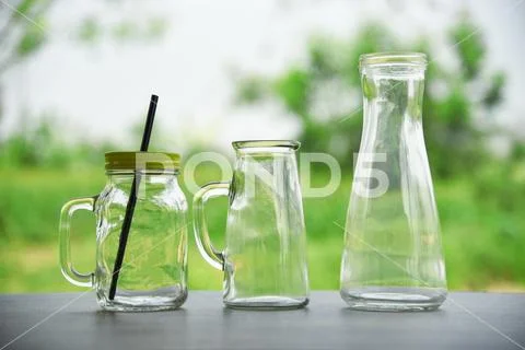 Zero waste use less plastic concept / water glass with straw pitcher jar and Stock Photos