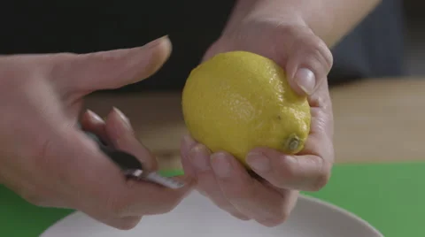 Zesting a lemon Stock Footage 63991365