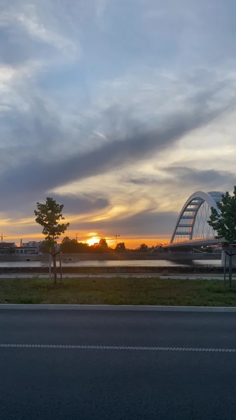 Zezelj Bridge over Danube River during vibrant sunset Novi Sad Stock Footage 339480128