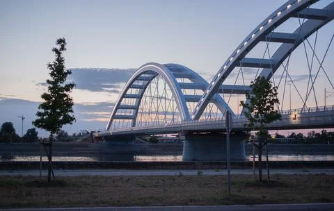Zezelj Bridge spans the Danube River in Novi Sad, Serbia, during a calm twilight Stock Photos
