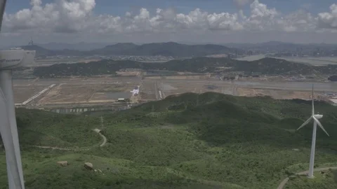 Zhuhai windmill mountain landscape pull back through the windmill 25 seconds Video stock 72794321