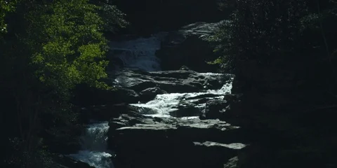 Zig-zag stream flowing through the rocks in slow motion Stock Footage 103822413