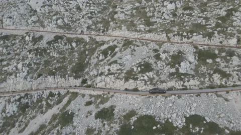 Zigzag alpine road in the rocky mountains. Curvy serpentine roads Stock Footage 214759097