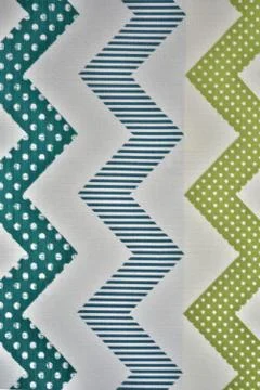 Zigzag lines of various colors, consisting of dots and straight lines on ligh Stock Illustration