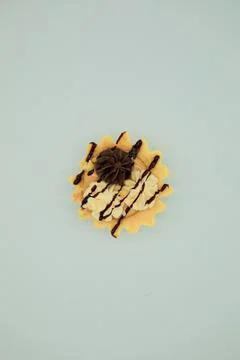 Zigzag pattern of chocolate sauce on the top of a cake Stock Photos