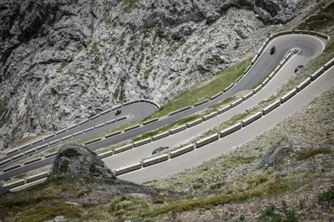 Zigzag road with motorcycles Stock Photos