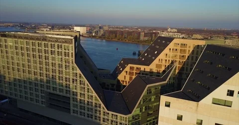 Zigzag roofline of a modern block above the IJ waterway Vídeos de archivo 71296892