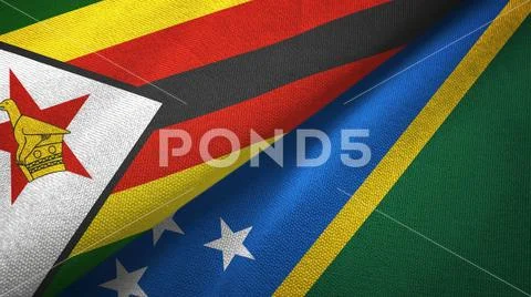 Zimbabwe and Solomon Islands two flags textile cloth, fabric texture Stock Photos